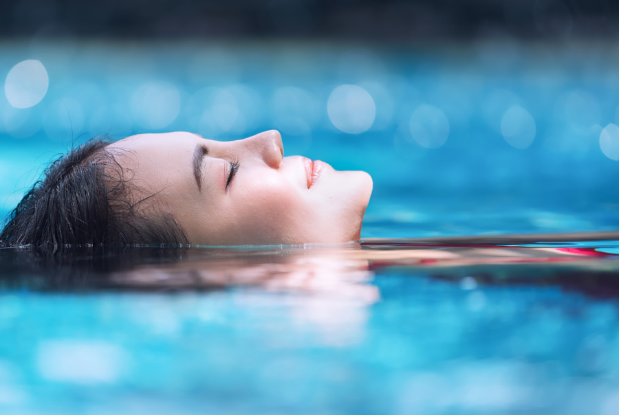 Woman relaxing in a pool